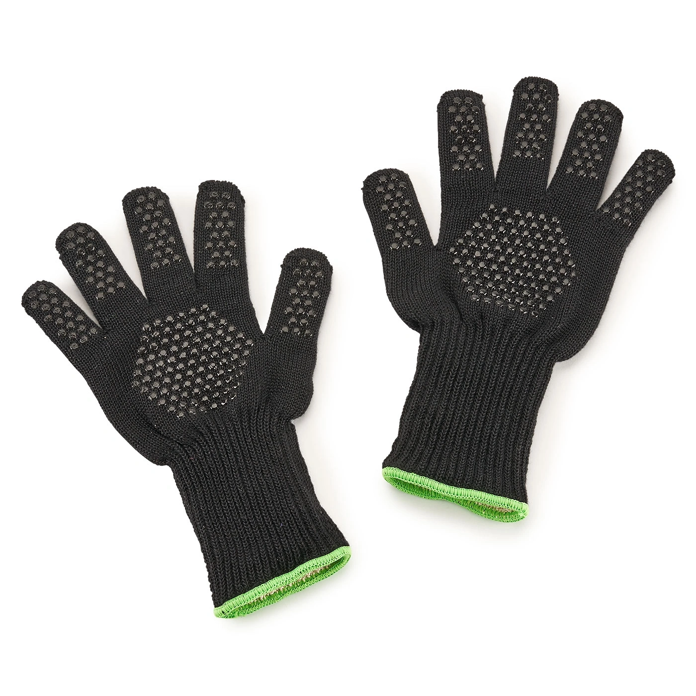 Schwarze Handschuhe mit grünen Akzenten und rutschfesten Punkten auf weißem Hintergrund.