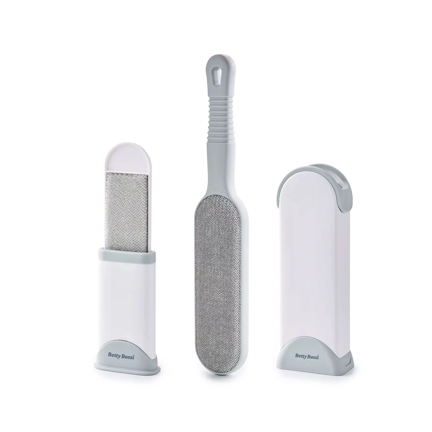 Ensemble de brosses anti-poils blanches et grises avec le logo 'Betty Bossi' sur la base.