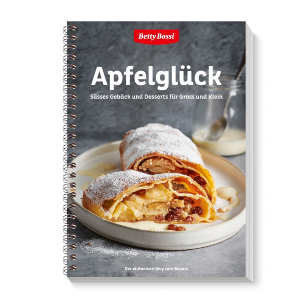 Un livre de cuisine avec un strudel aux pommes intitulé "Apfelglück".