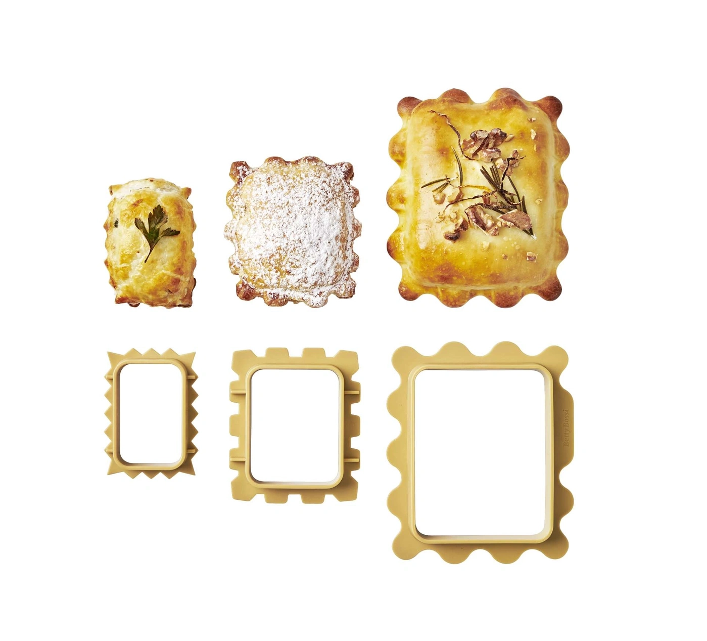 Pâtisseries et emporte-pièces de différentes formes et tailles sur fond blanc.