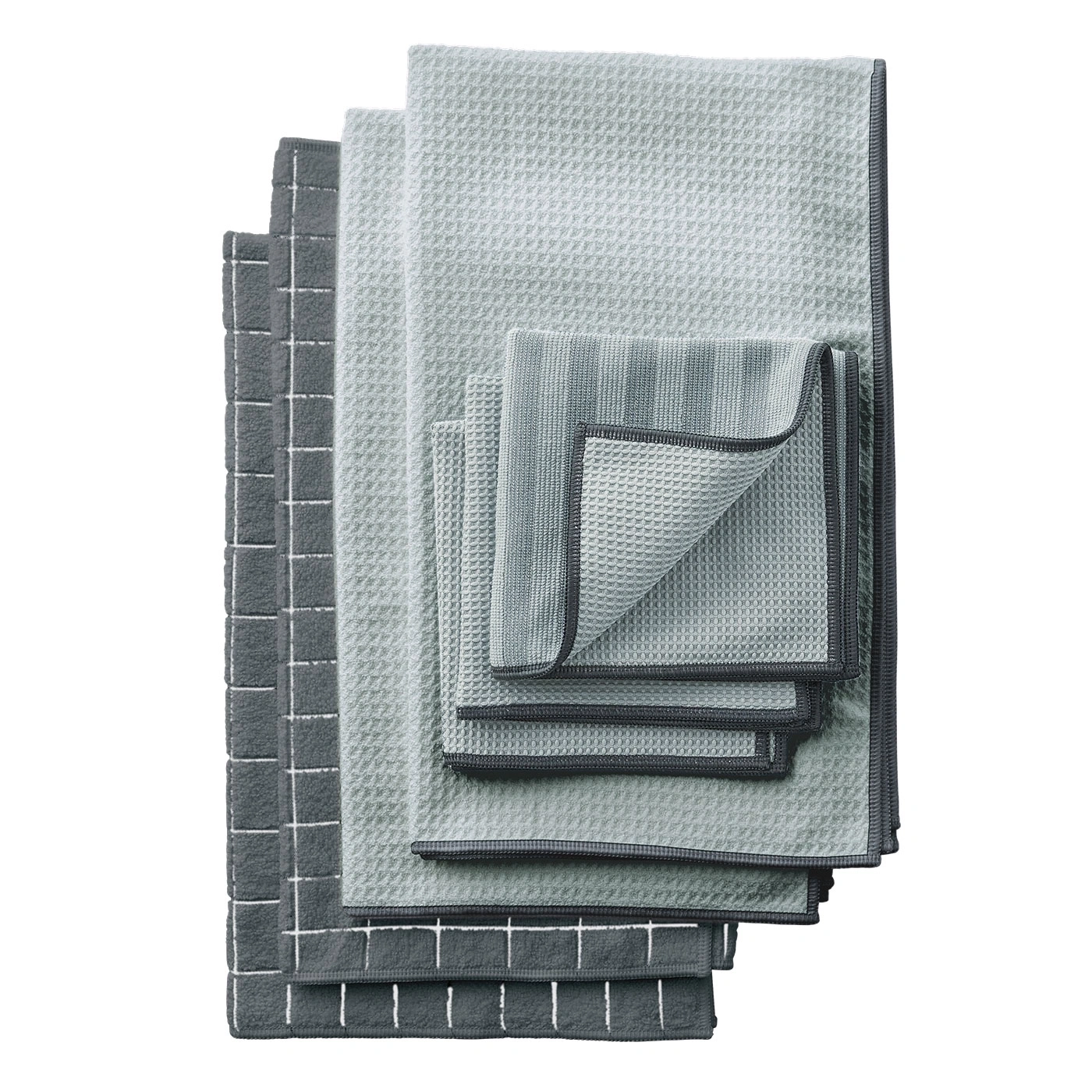 Serviettes grises empilées, textures variées, surface propre, accessoires de salle de bain, empilement.