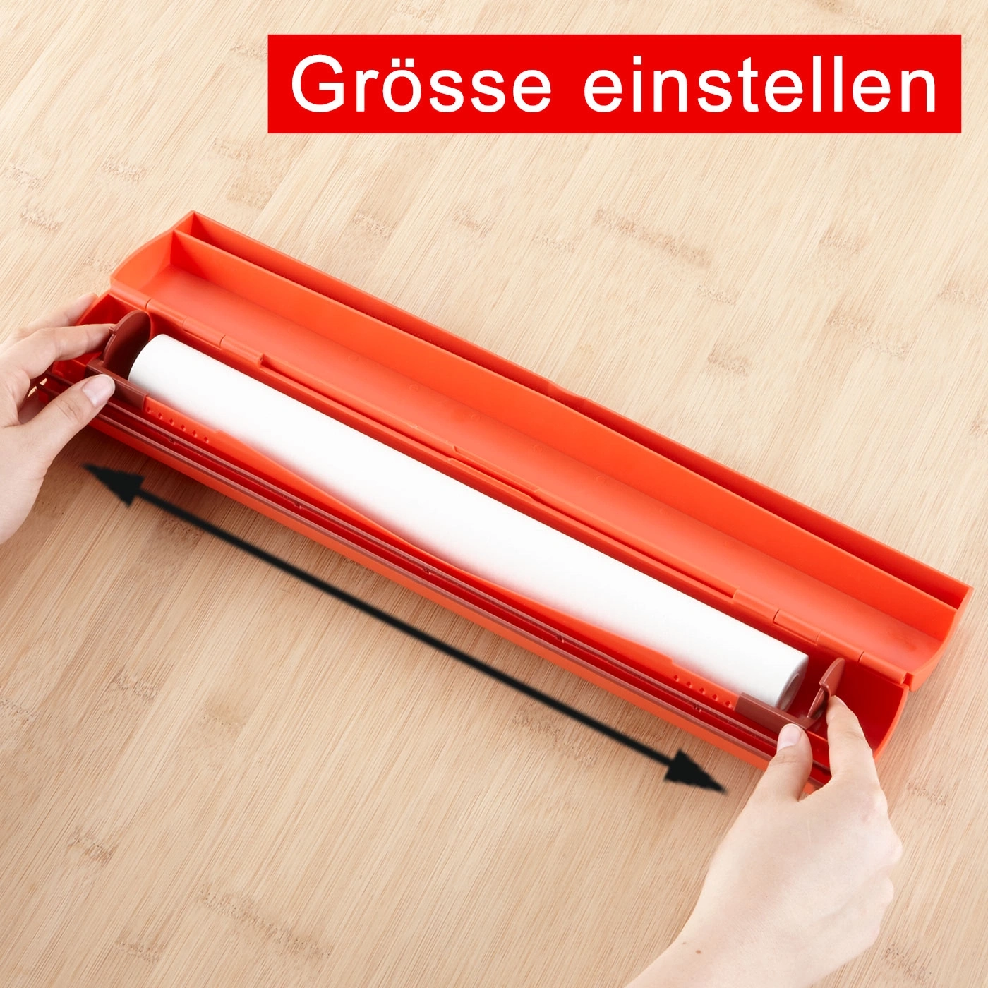 Orange Gerät mit weißer Rolle, Pfeil zeigt auf die Größenanpassung.