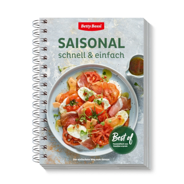 Kochbuch "Saisonal schnell & einfach" von Betty Bossi mit einem Teller Caprese-Salat