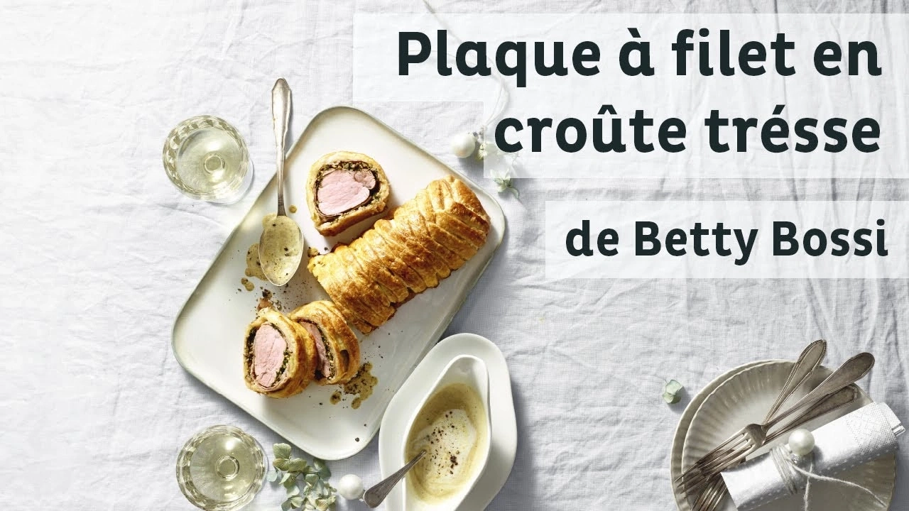 Plat de viande en croûte tressée, servi avec sauce et vin, par Betty Bossi.