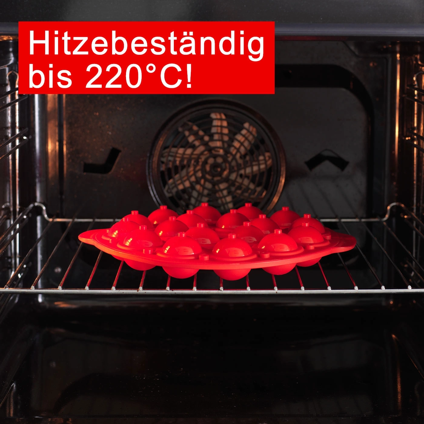 Roter Silikon-Backform im Ofen, hitzebeständig bis 220°C, bereit zum Backen.