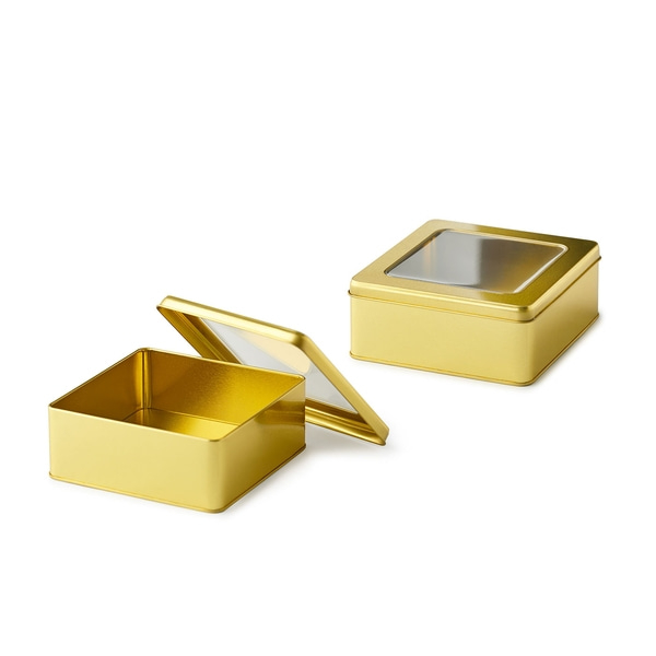 Boîtes dorées avec couvercles transparents, ouvertes et fermées, sur fond blanc.